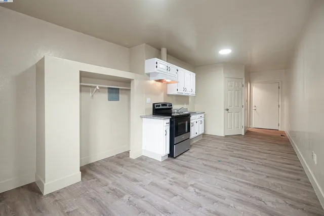 a view of kitchen with sink microwave and stove