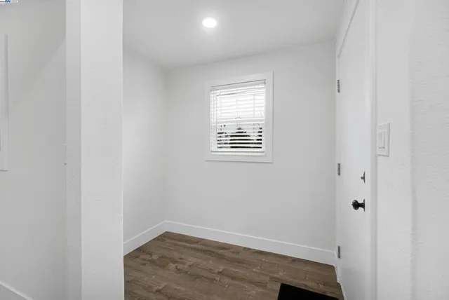 a view of an empty room with closet