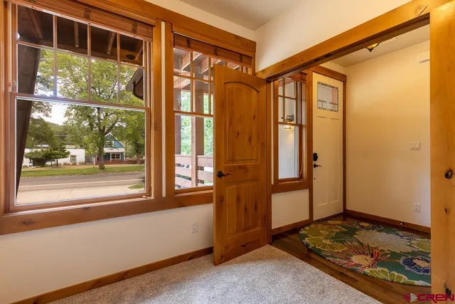 a bedroom with a bed and a night stand