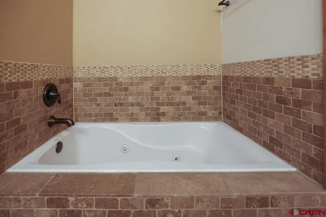 a view of a chairs and table in the patio