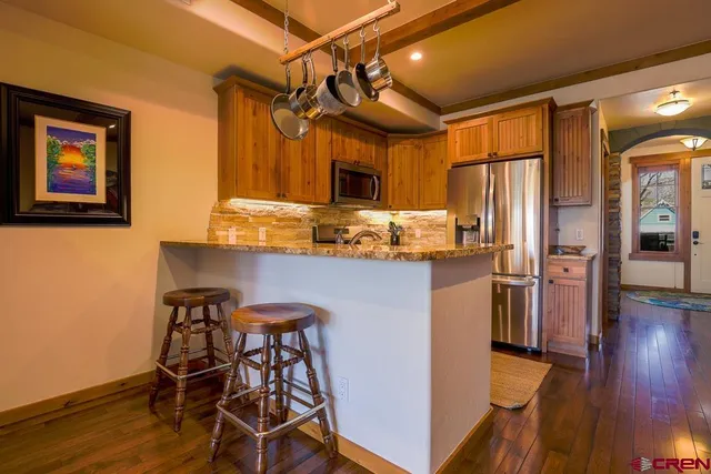 a swimming pool with outdoor seating