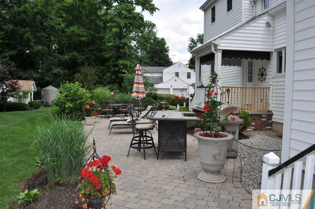 110 Stafford Road Colonia, NJ 07067 - Photo 17 of 24 a view of a patio with table and chairs potted plants