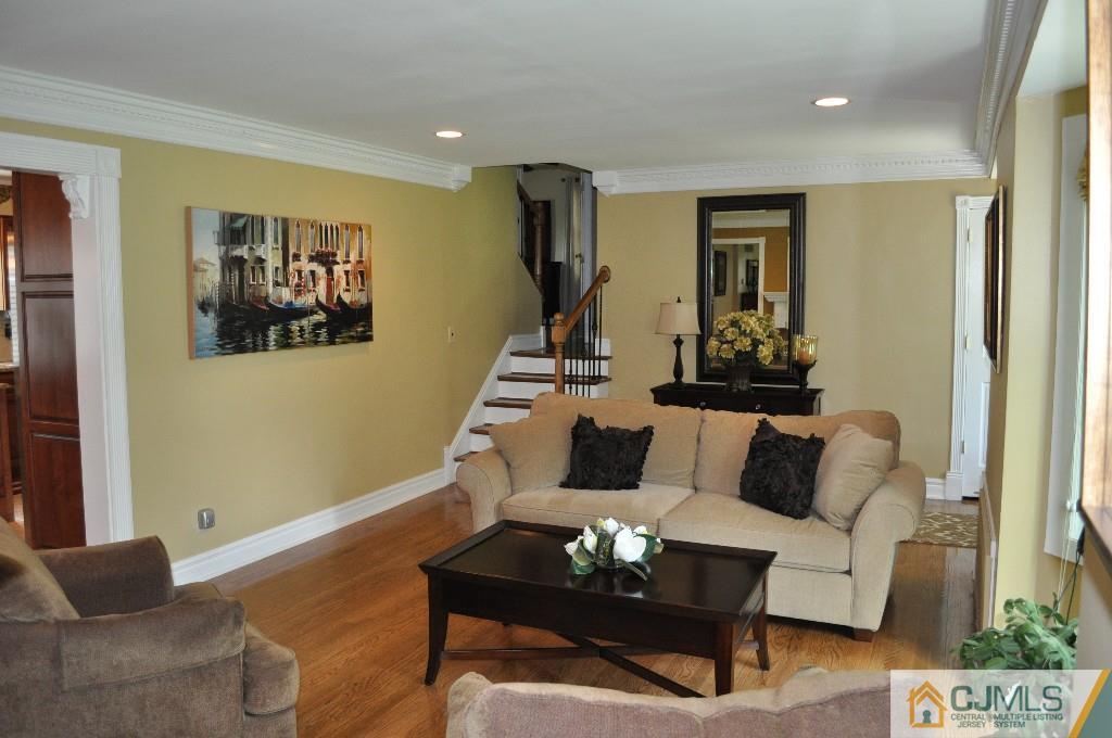 110 Stafford Road Colonia, NJ 07067 - Photo 6 of 24 a living room with furniture and wooden floor