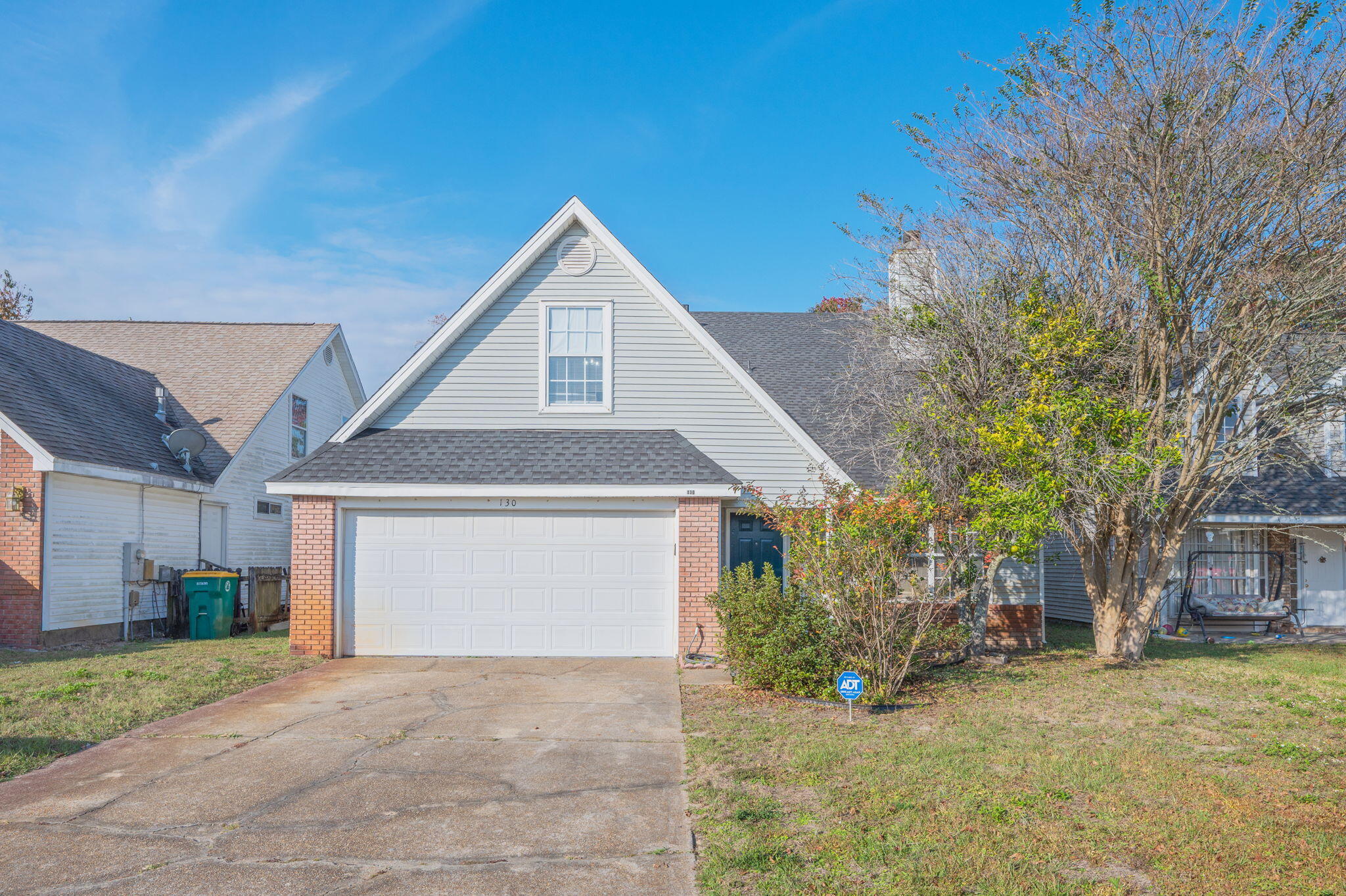 130 Scranton Street Fort Walton Beach, FL 32547 - Photo 1 of 47 a front view of a house with a yard and garage