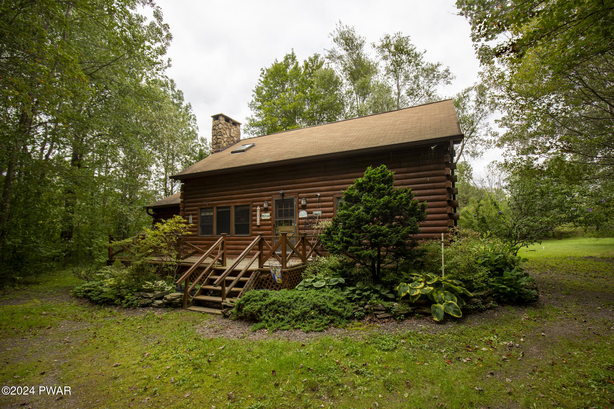 52 Wash Road Waymart, PA 18472 - Photo 4 of 90 a view of a house with backyard sitting area and garden