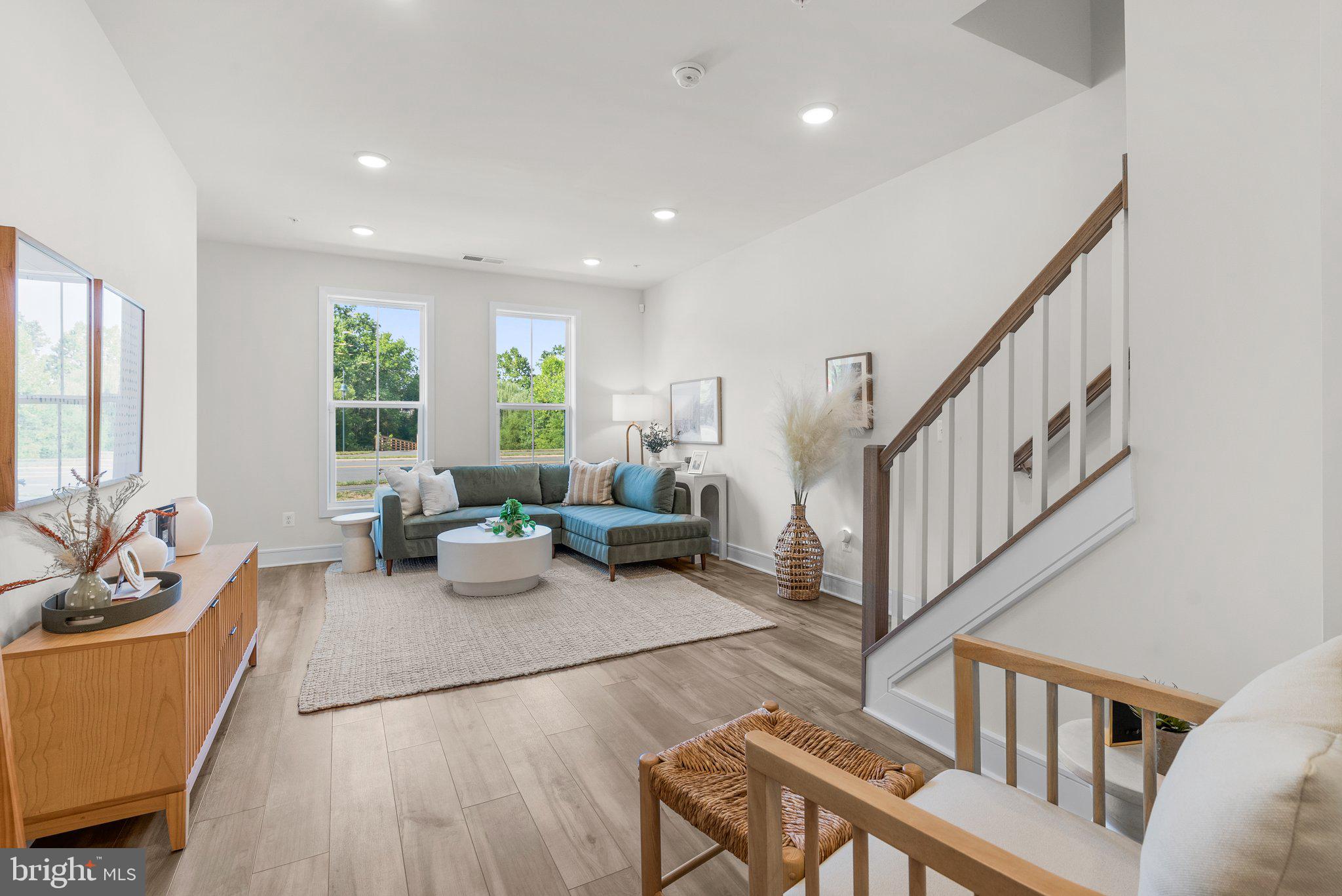 43176 Farringdon Square Broadlands, VA 20148 - Photo 20 of 33 a living room with furniture and a wooden floor