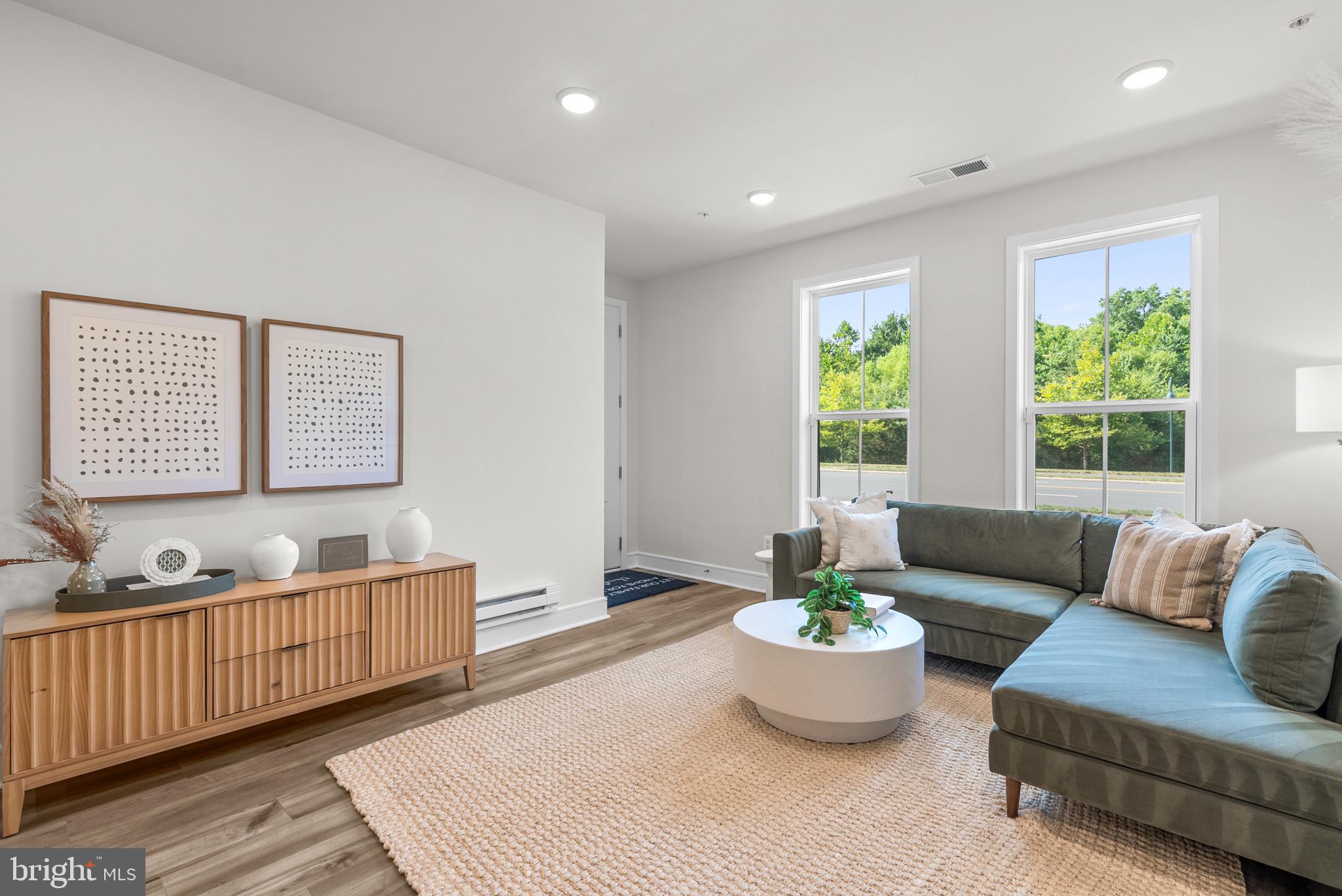 43176 Farringdon Square Broadlands, VA 20148 - Photo 22 of 33 a living room with furniture and a large window