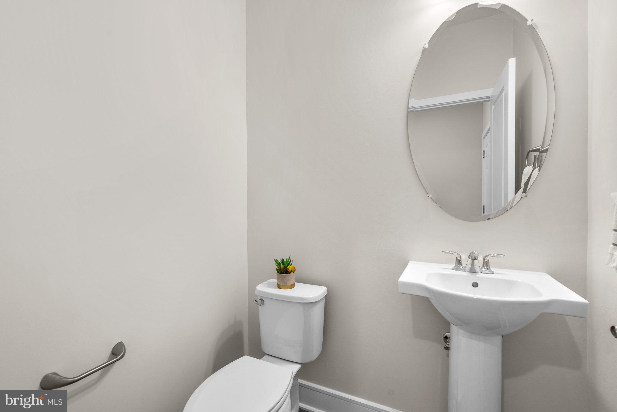 43176 Farringdon Square Broadlands, VA 20148 - Photo 23 of 33 a bathroom with a sink toilet and a mirror