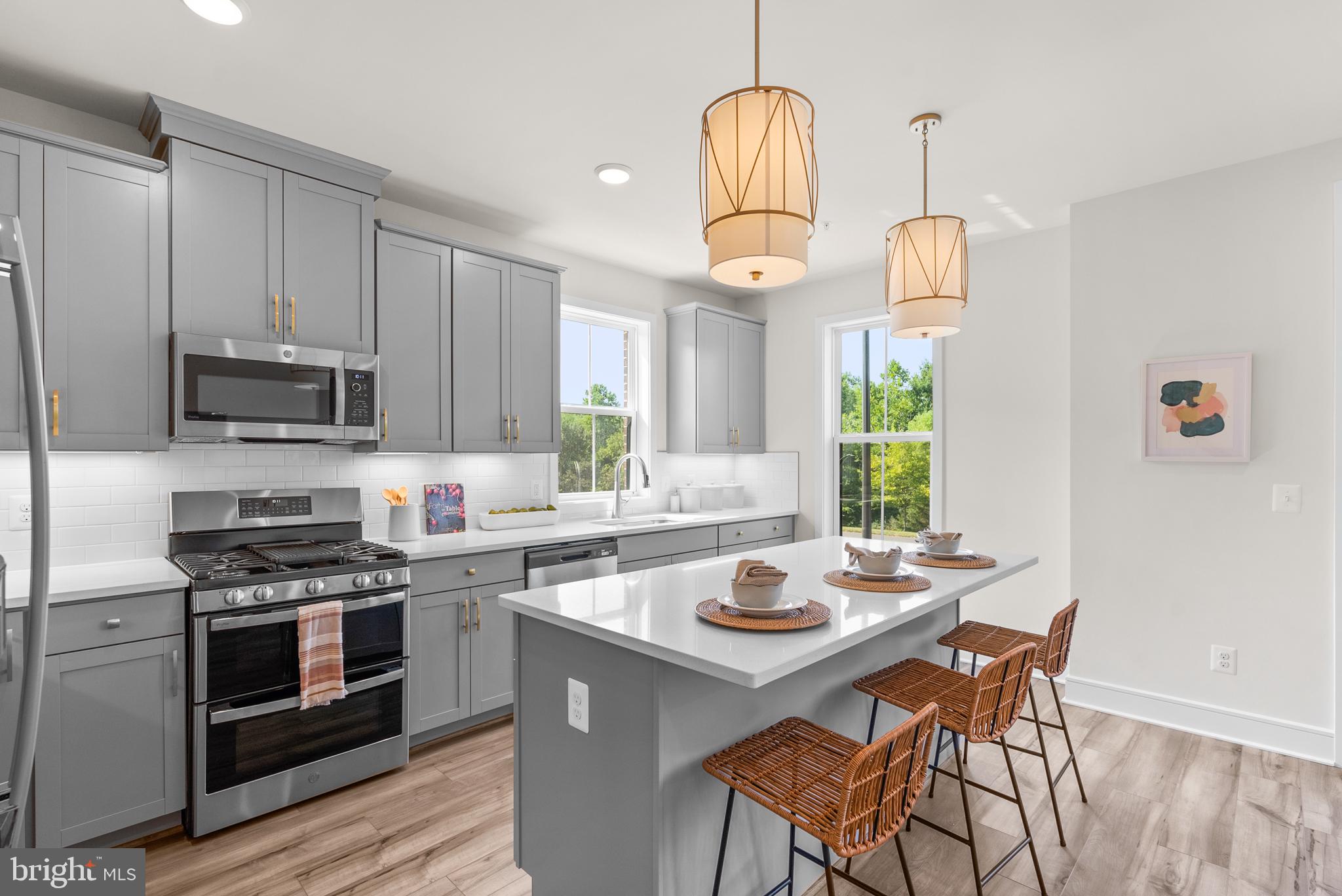 43176 Farringdon Square Broadlands, VA 20148 - Photo 4 of 33 a kitchen with a sink cabinets and window