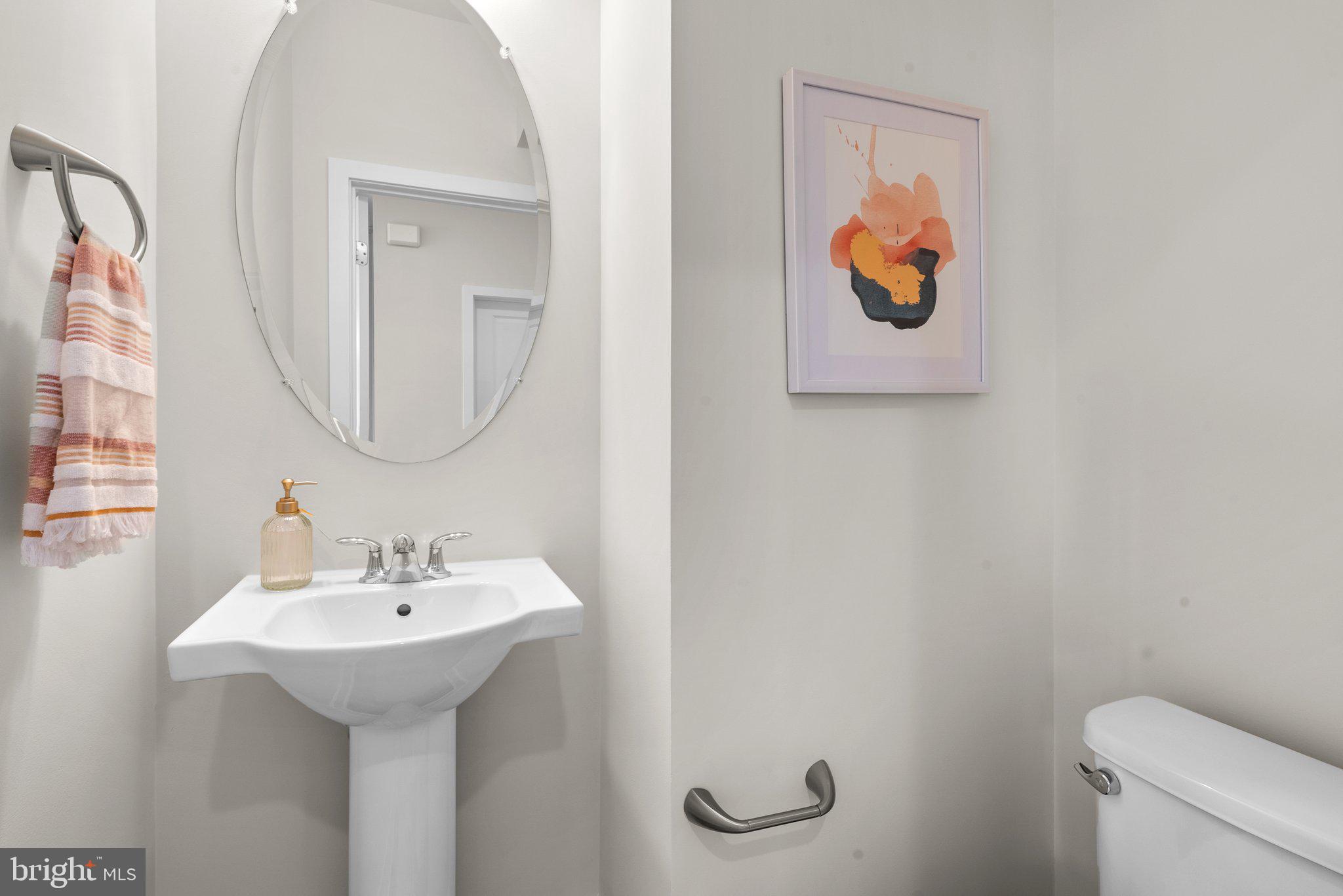 43176 Farringdon Square Broadlands, VA 20148 - Photo 9 of 33 a bathroom with a sink mirror and toilet