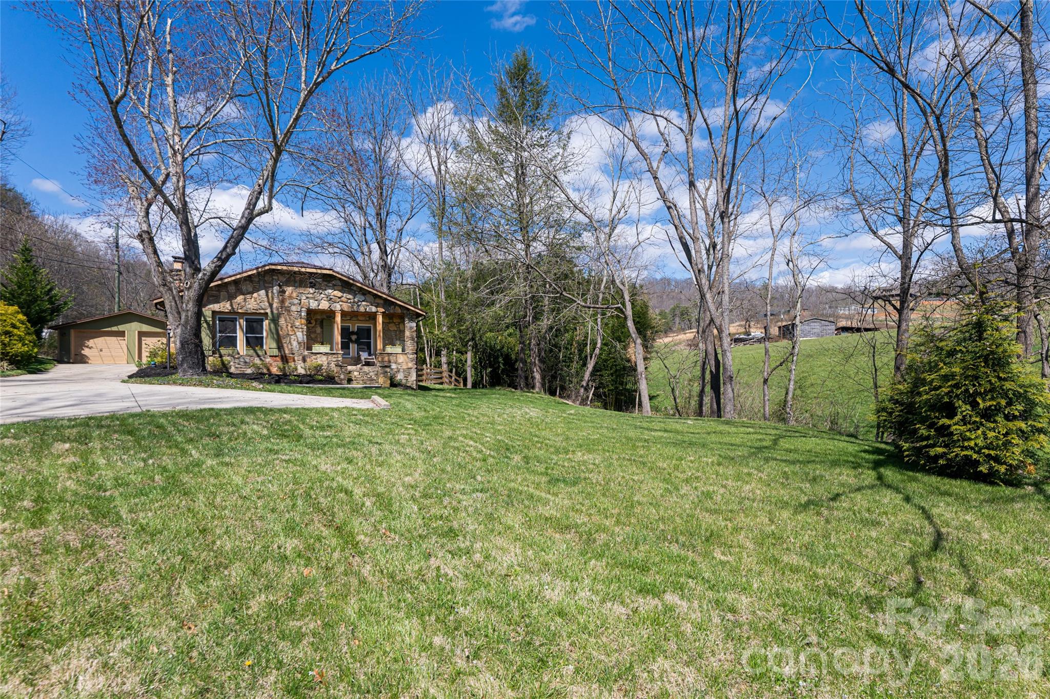 86 Rolling Hills Road Canton, NC 28716 - Photo 43 of 48 a front view of a house with garden