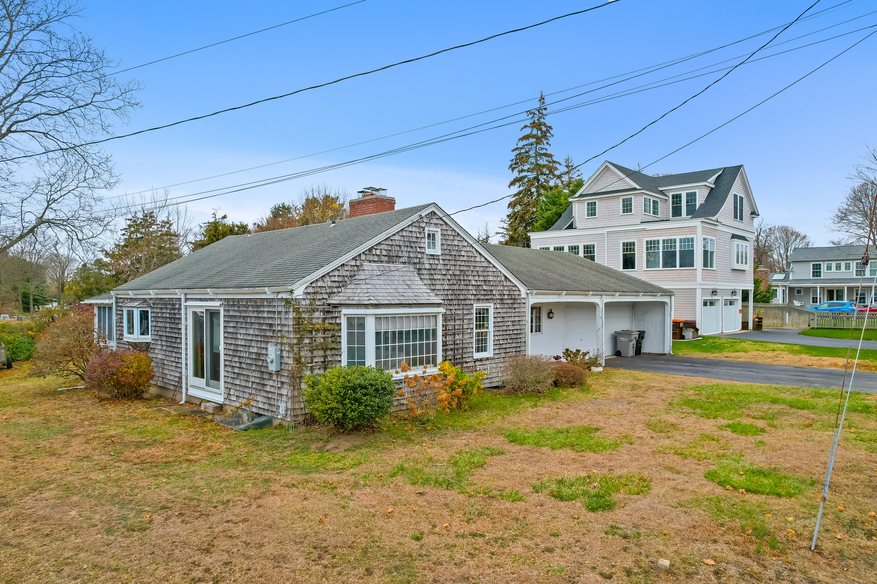 21 Fenwick Street Old Saybrook, CT 06475 - Photo 1 of 15 front view of a house with a yard