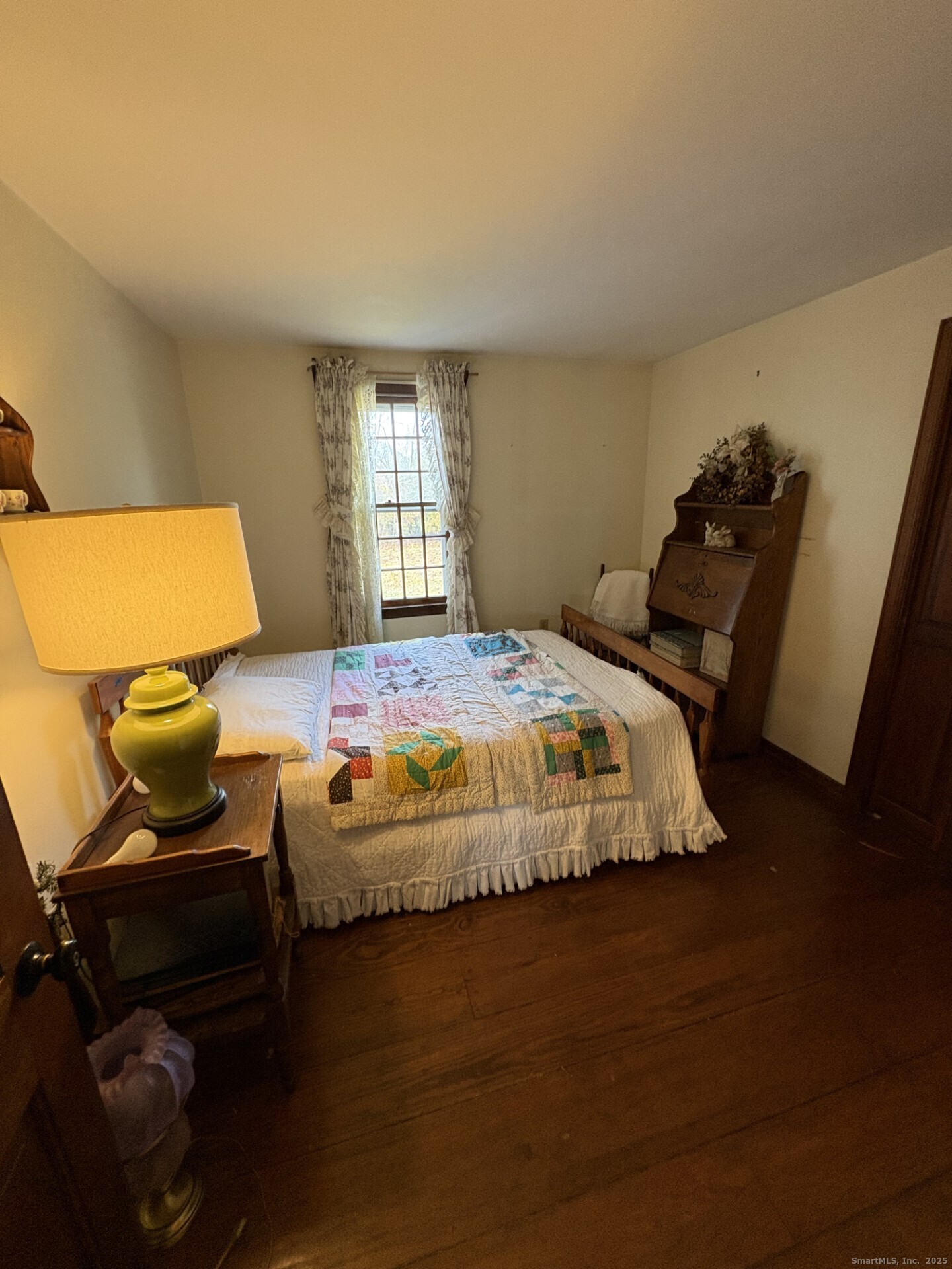 21 Fenwick Street Old Saybrook, CT 06475 - Photo 11 of 15 a bedroom with bed and chair