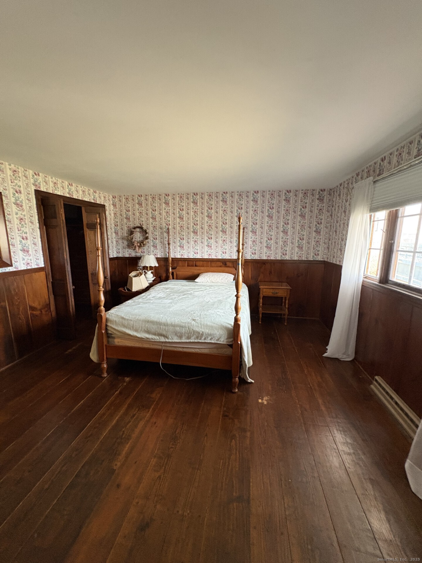 21 Fenwick Street Old Saybrook, CT 06475 - Photo 13 of 15 a bedroom with furniture and wooden floor