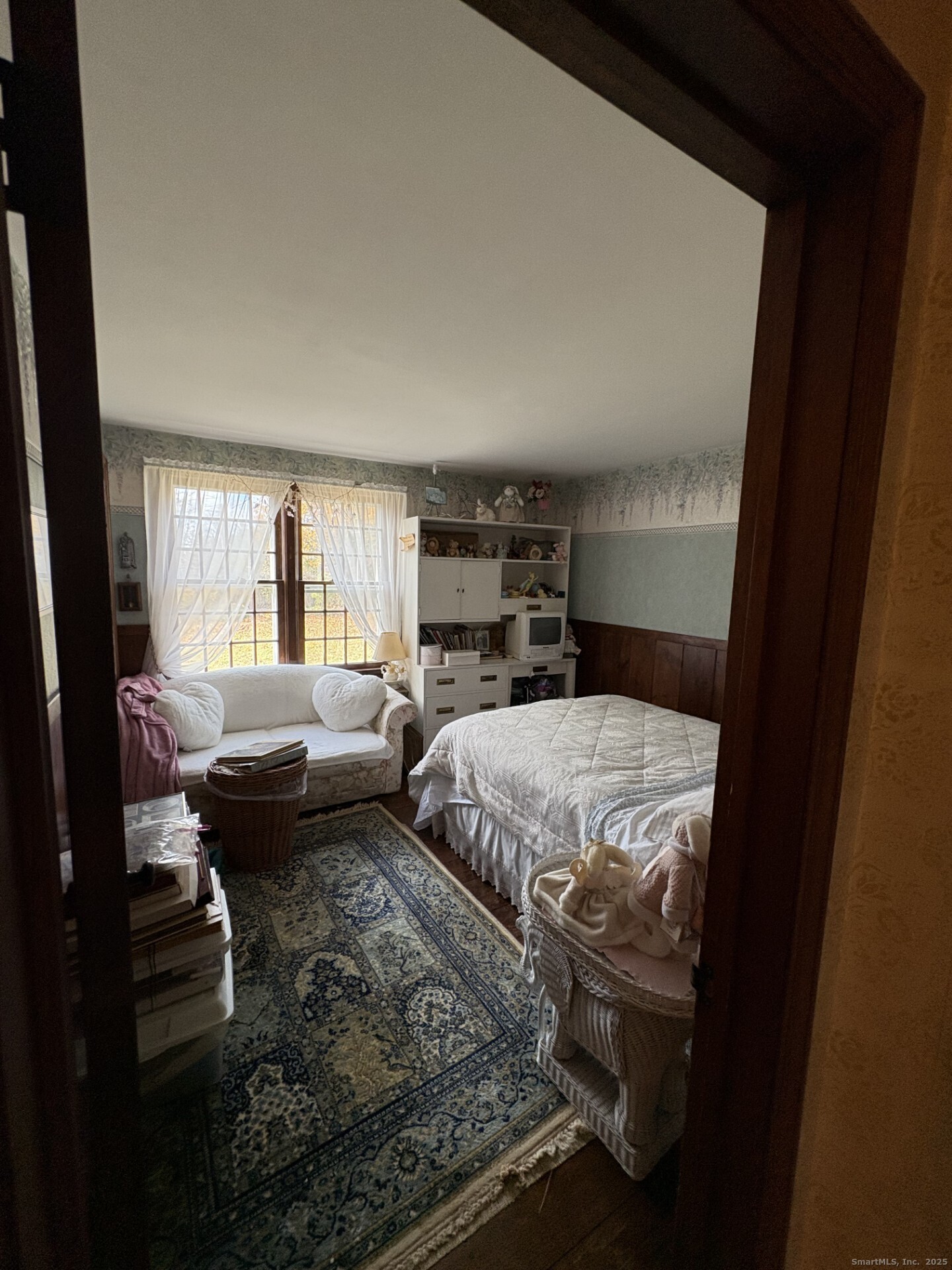 21 Fenwick Street Old Saybrook, CT 06475 - Photo 14 of 15 a bedroom with a bed and wooden floor