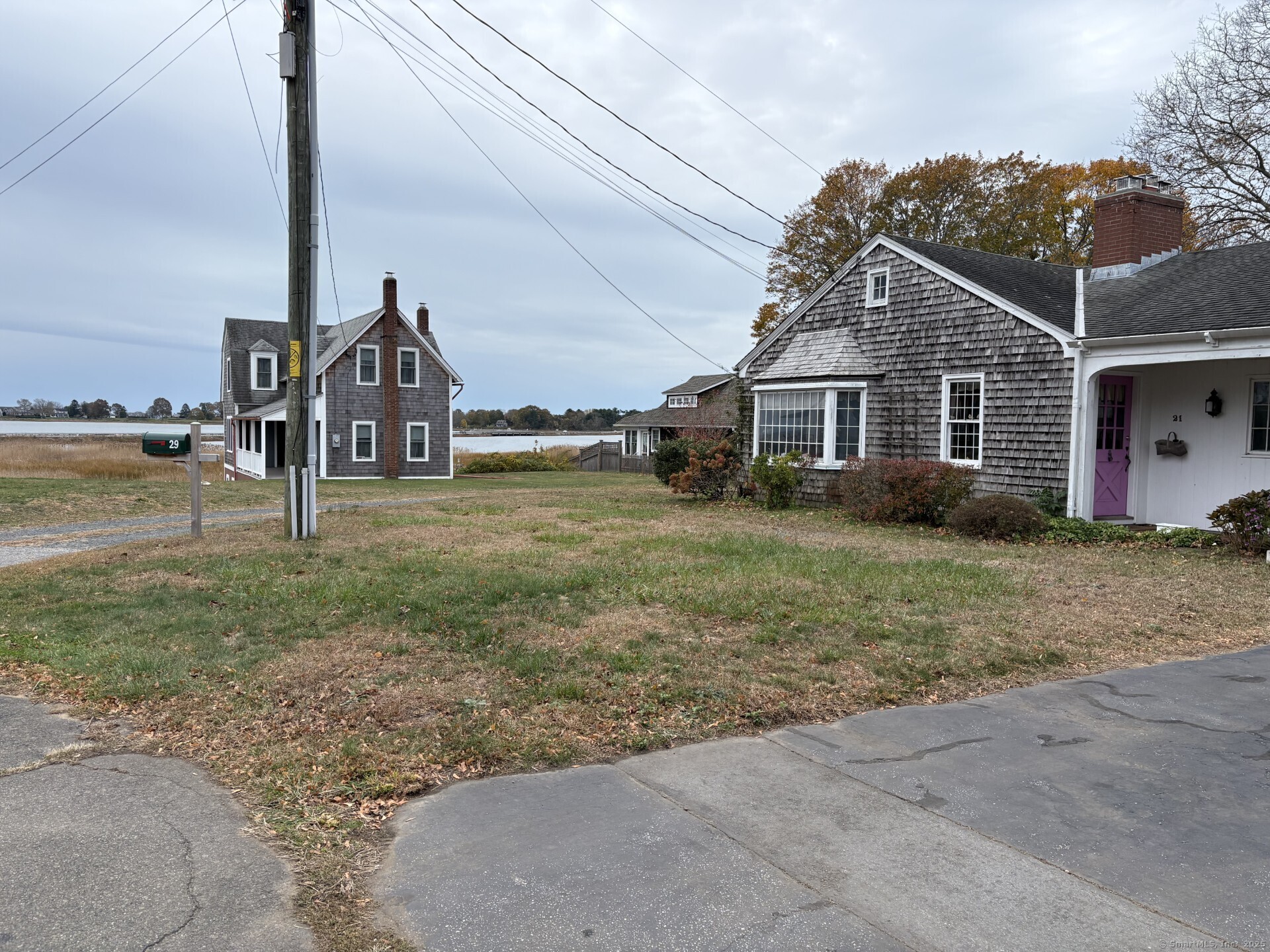 21 Fenwick Street Old Saybrook, CT 06475 - Photo 7 of 15 a view of a house with a yard