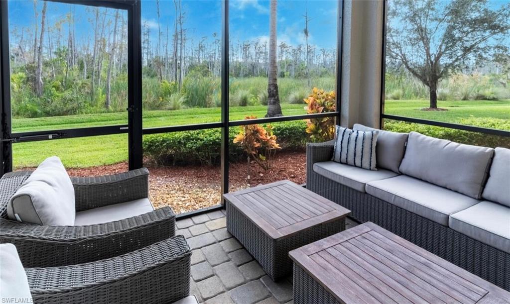 a view of a patio with couches and pool