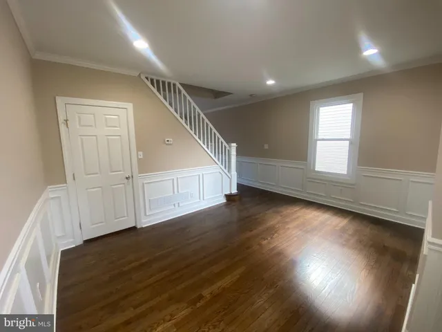 a kitchen with granite countertop a stove and a sink