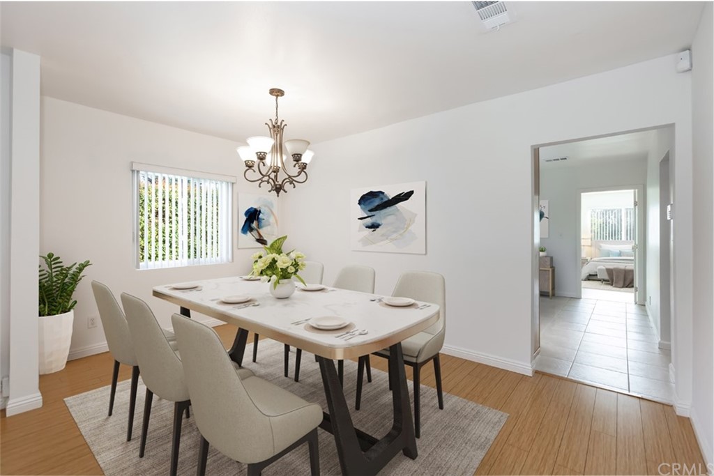 610 Del Monte Street Pasadena, CA 91103 - Photo 12 of 49 a dining room with furniture a chandelier and wooden floor