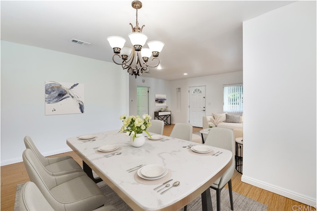 610 Del Monte Street Pasadena, CA 91103 - Photo 13 of 49 a view of a dining room with furniture and chandelier