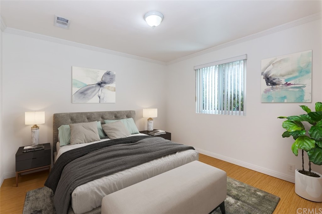 610 Del Monte Street Pasadena, CA 91103 - Photo 25 of 49 a bedroom with a bed and a potted plant