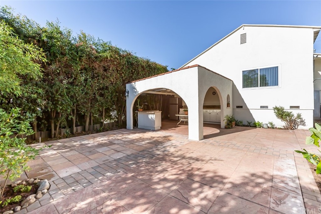 610 Del Monte Street Pasadena, CA 91103 - Photo 35 of 49 a view of a grey house with a yard