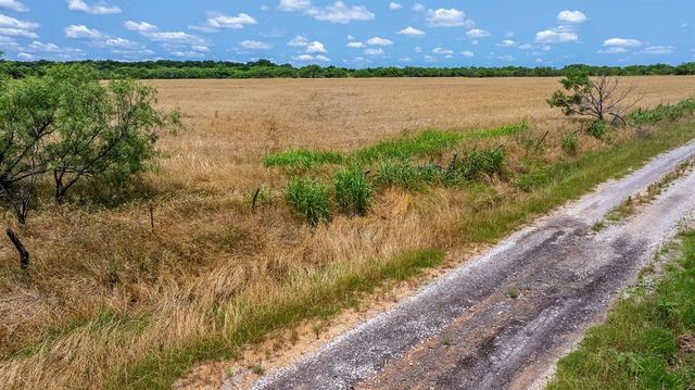 a view of a lake from a yard