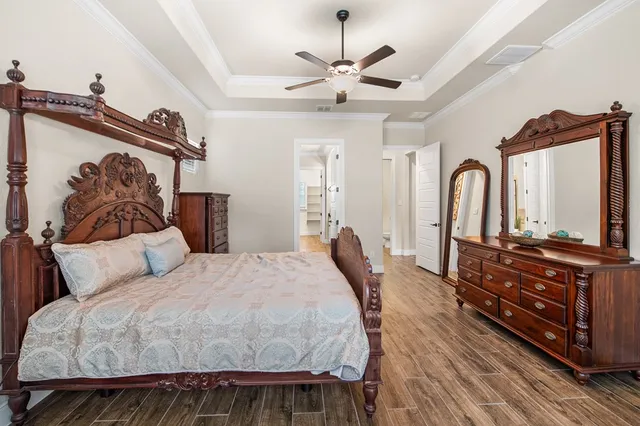 a large white bathroom with a granite countertop tub a sink and a large mirror