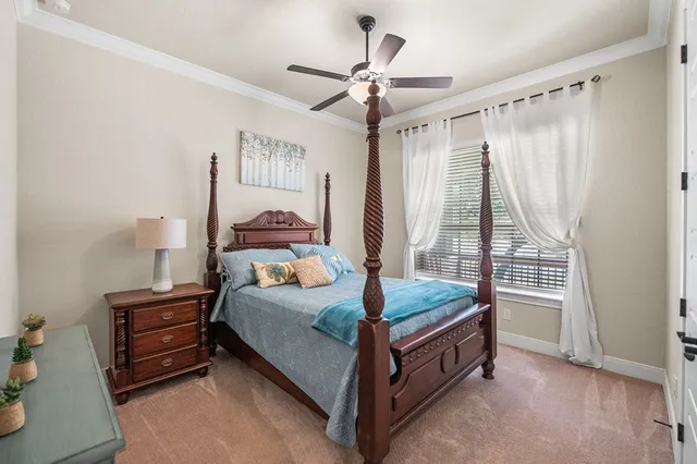 a bedroom with a bed and dresser