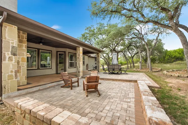 a view of a forest with a yard