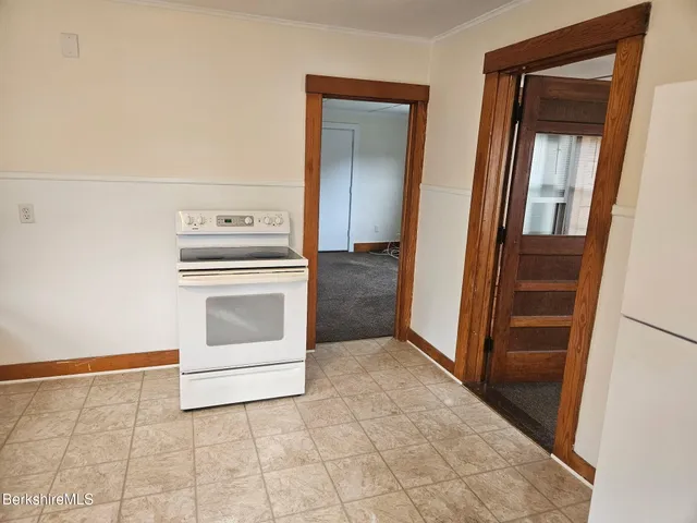 a view of a hallway with washer and dryer