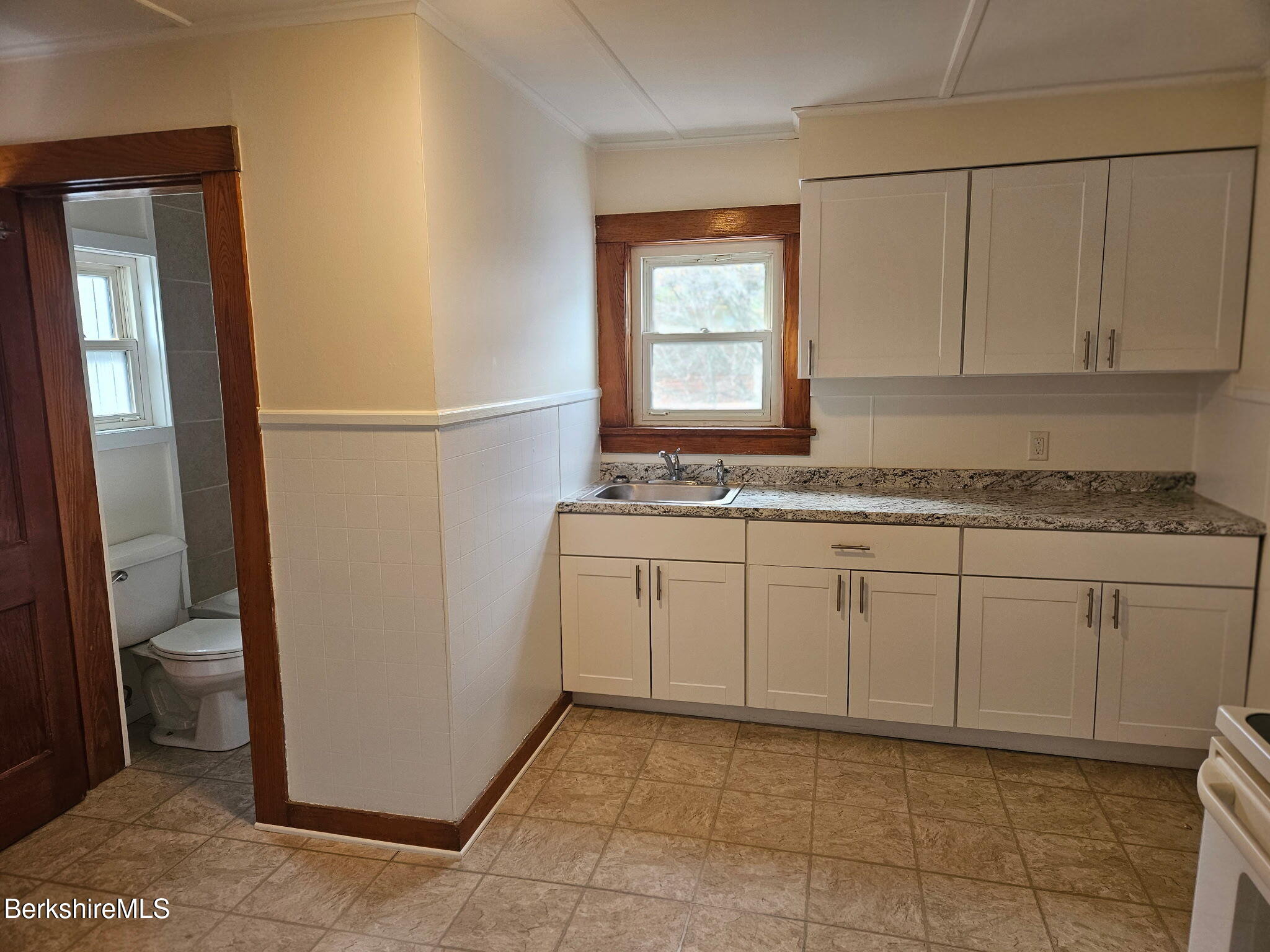 1 Edward Avenue Adams, MA 01220 - Photo 6 of 9 a kitchen with a sink window and cabinets