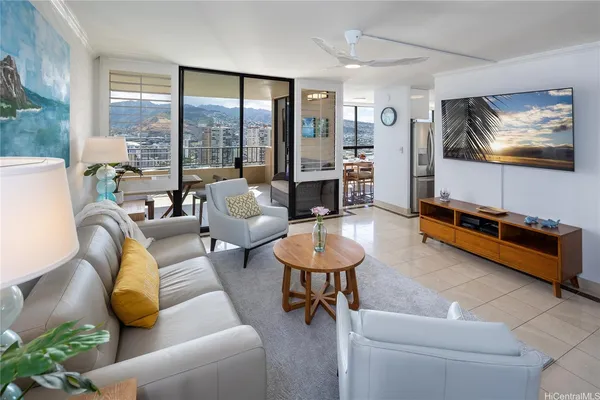 a living room with furniture and a flat screen tv