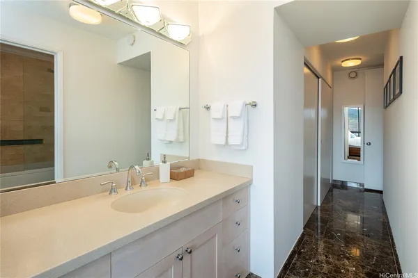a bathroom with a sink and a mirror