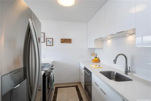 a bathroom with a sink a toilet and a shower