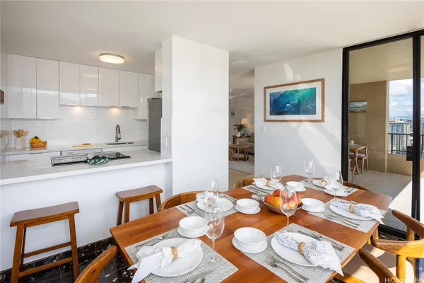a kitchen with a table and chairs in it