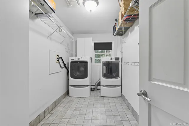 a work room with furniture and a flat screen tv