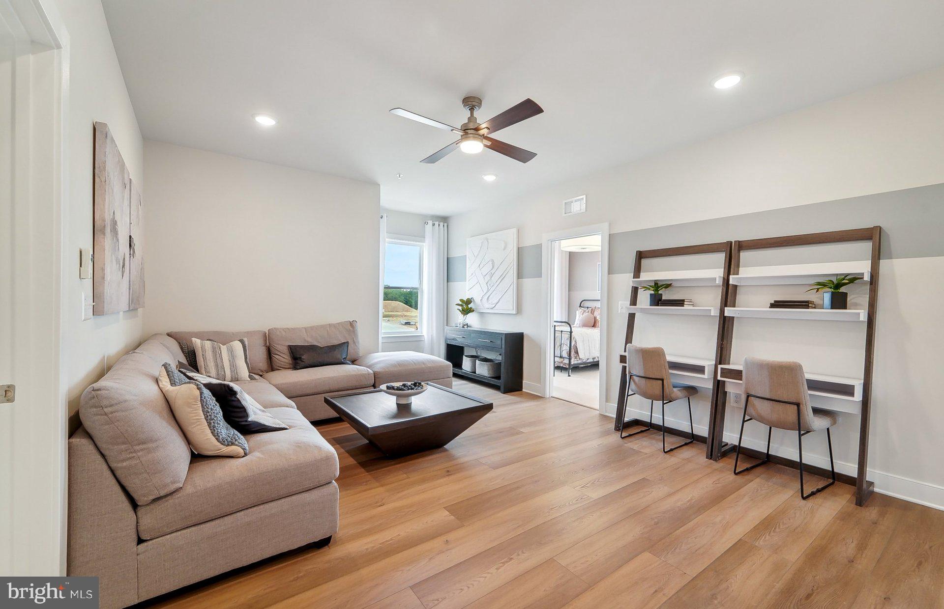 22512 Sculpin Brk Road Boyds, MD 20841 - Photo 20 of 69 a living room with furniture and wooden floor
