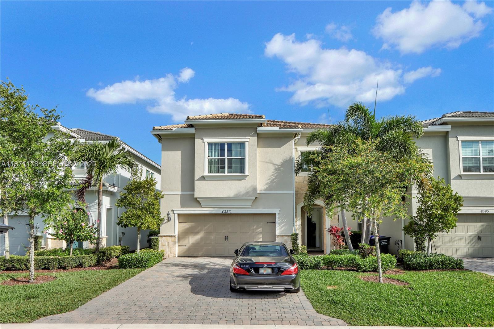 4353 Large Leaf Lane Hollywood, FL 33021 - Photo 1 of 31 a car parked in front of a white house