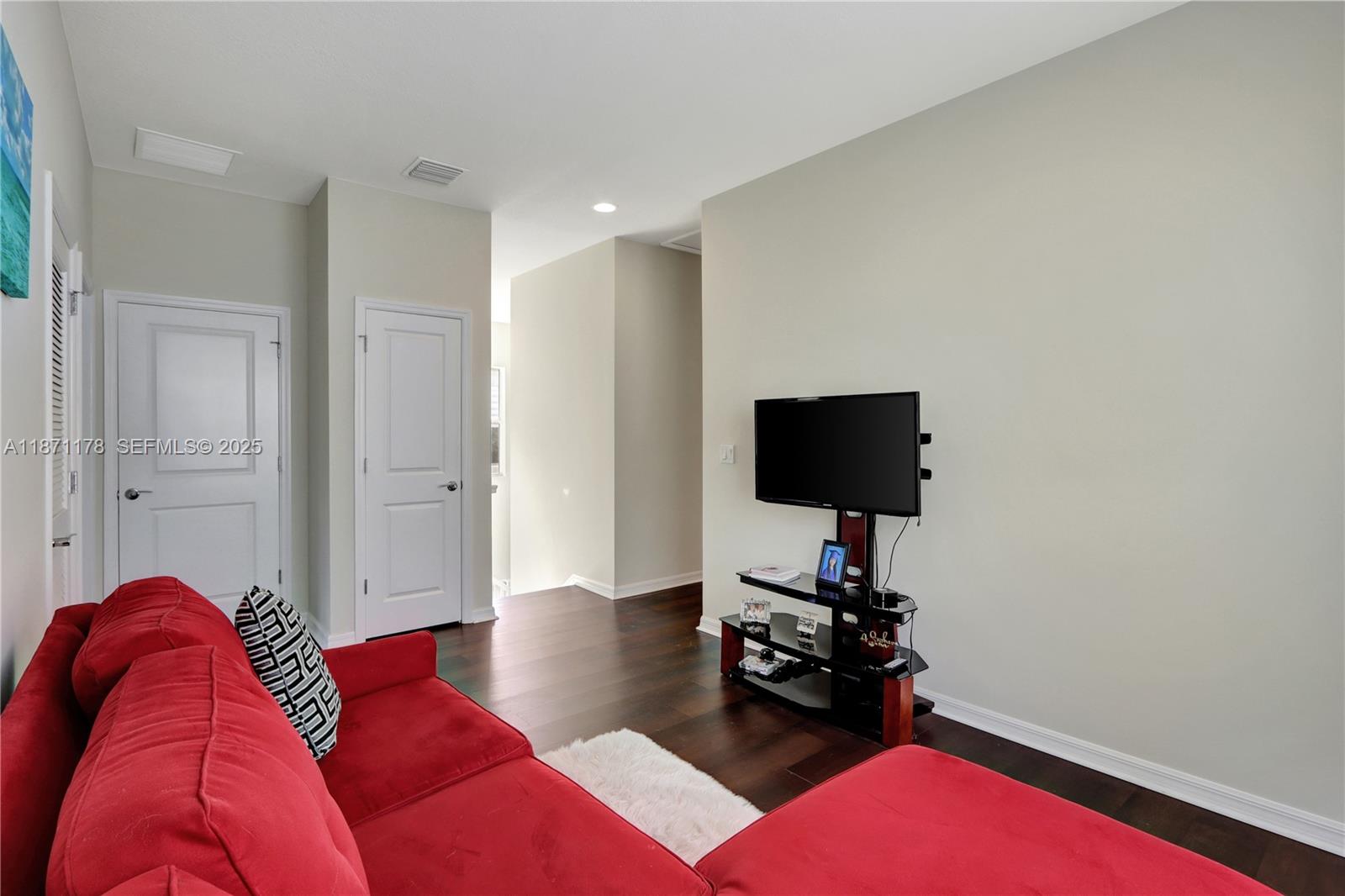 4353 Large Leaf Lane Hollywood, FL 33021 - Photo 17 of 31 a living room with furniture and a flat screen tv