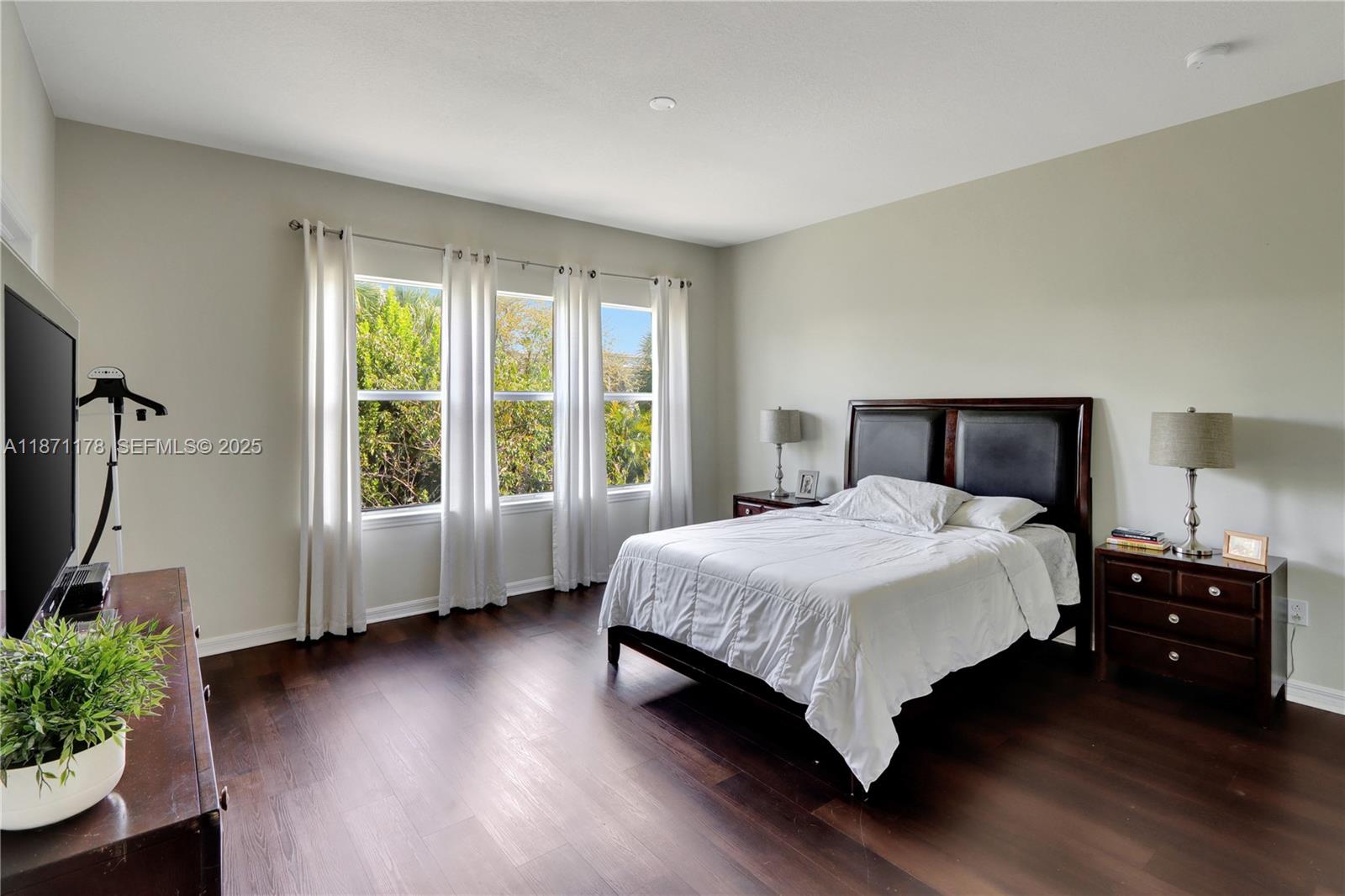 4353 Large Leaf Lane Hollywood, FL 33021 - Photo 18 of 31 a bedroom with a bed and a large window
