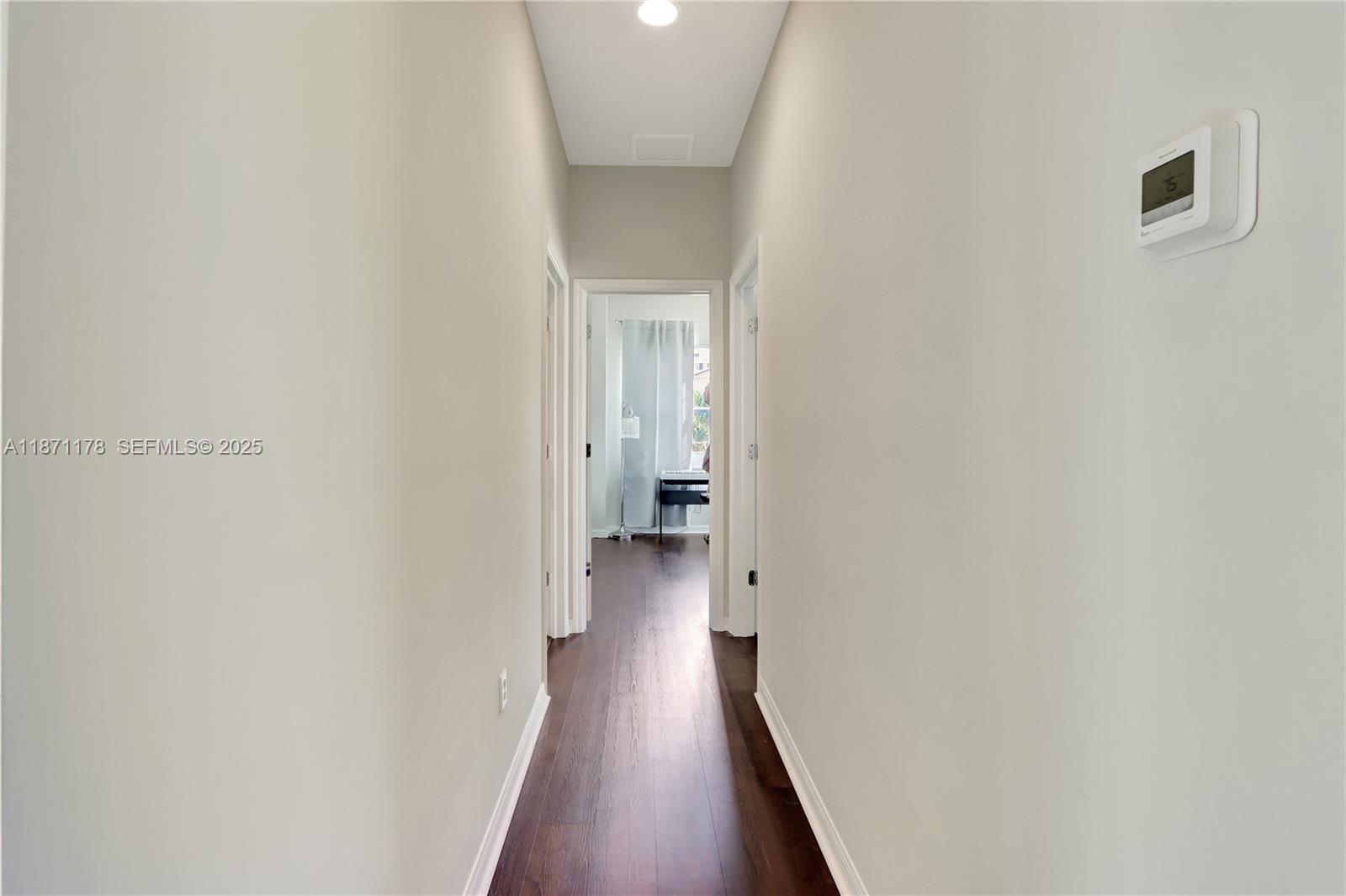 4353 Large Leaf Lane Hollywood, FL 33021 - Photo 23 of 31 a view of a hallway with wooden floor