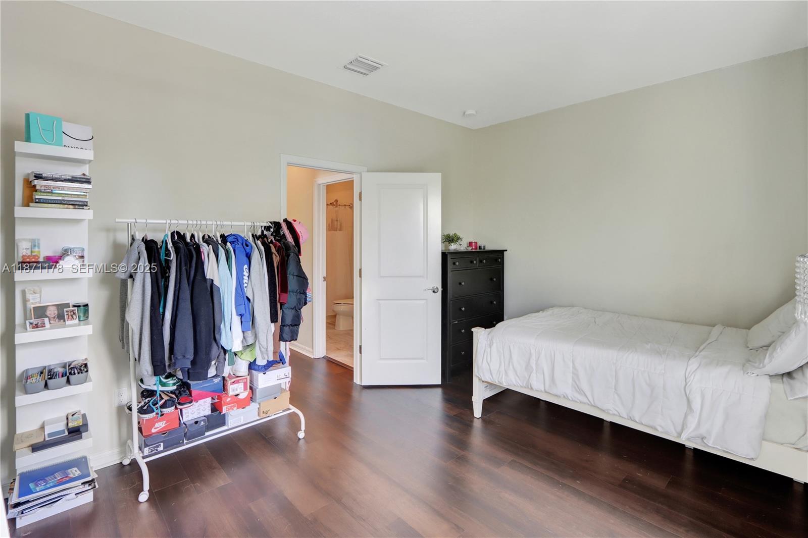 4353 Large Leaf Lane Hollywood, FL 33021 - Photo 24 of 31 a bedroom with a bed and a walk in closet