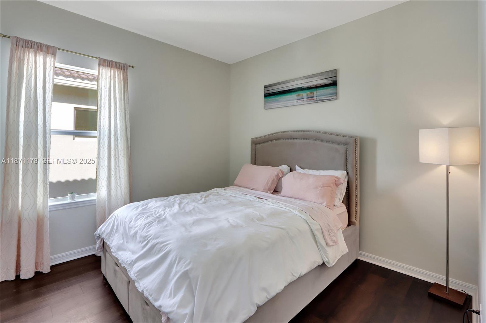 4353 Large Leaf Lane Hollywood, FL 33021 - Photo 26 of 31 a large bed sitting in a bedroom next to a window