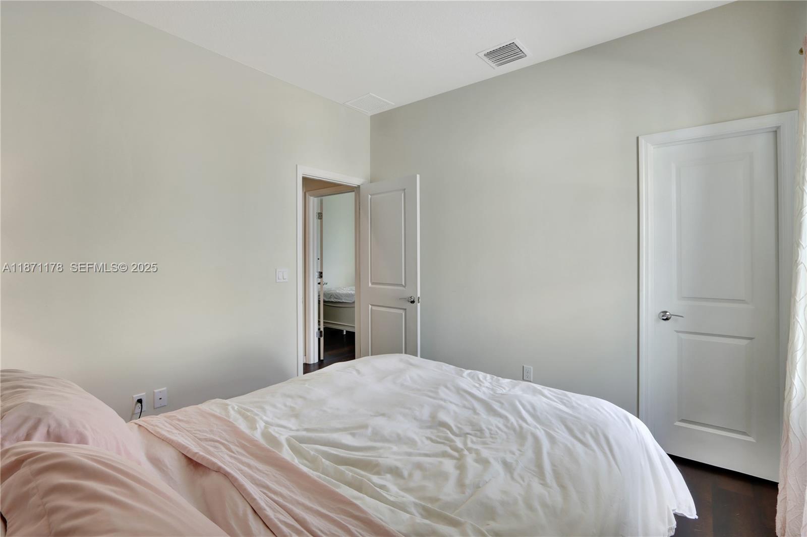 4353 Large Leaf Lane Hollywood, FL 33021 - Photo 27 of 31 a bedroom with a bed and cabinet