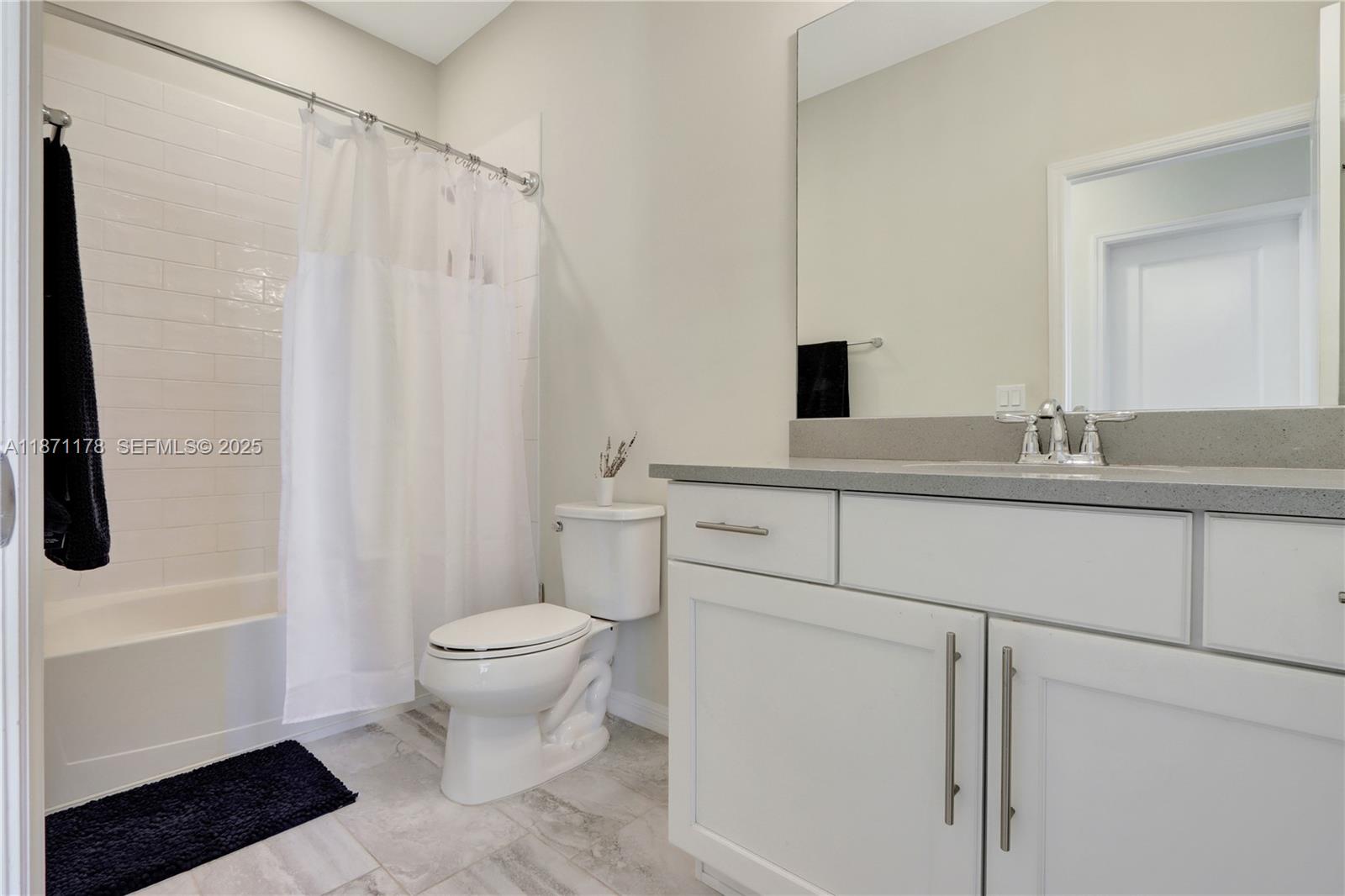 4353 Large Leaf Lane Hollywood, FL 33021 - Photo 28 of 31 a bathroom with a sink toilet and shower