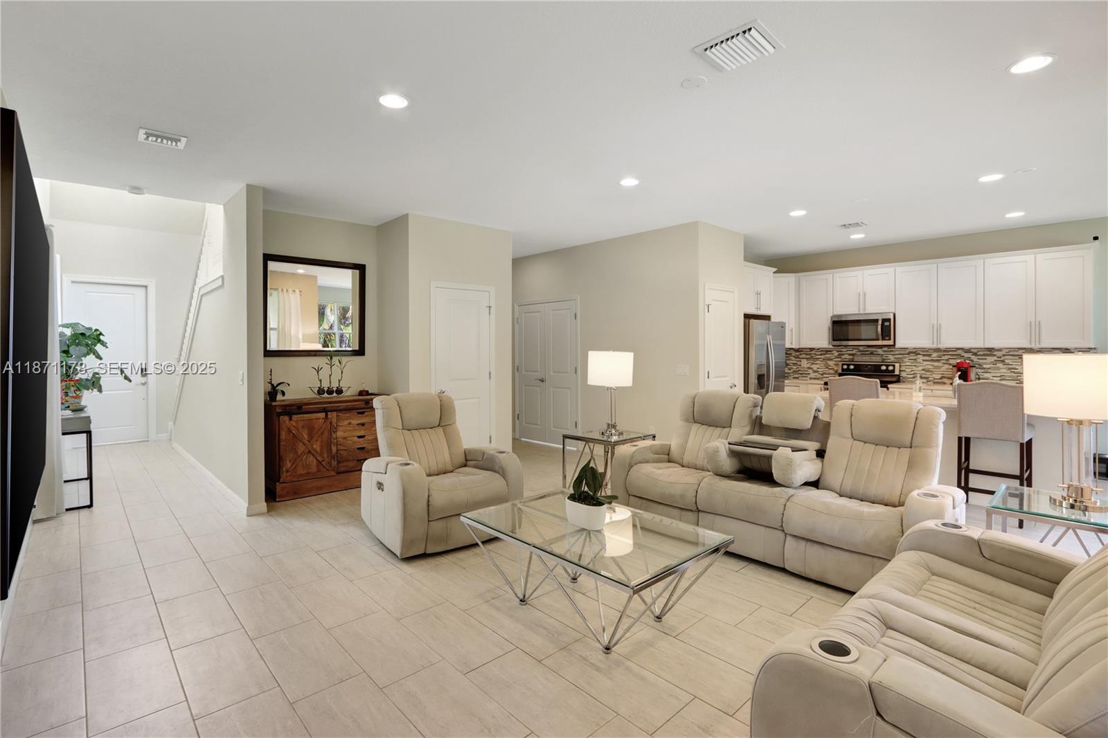 4353 Large Leaf Lane Hollywood, FL 33021 - Photo 6 of 31 a living room with furniture and a view of kitchen