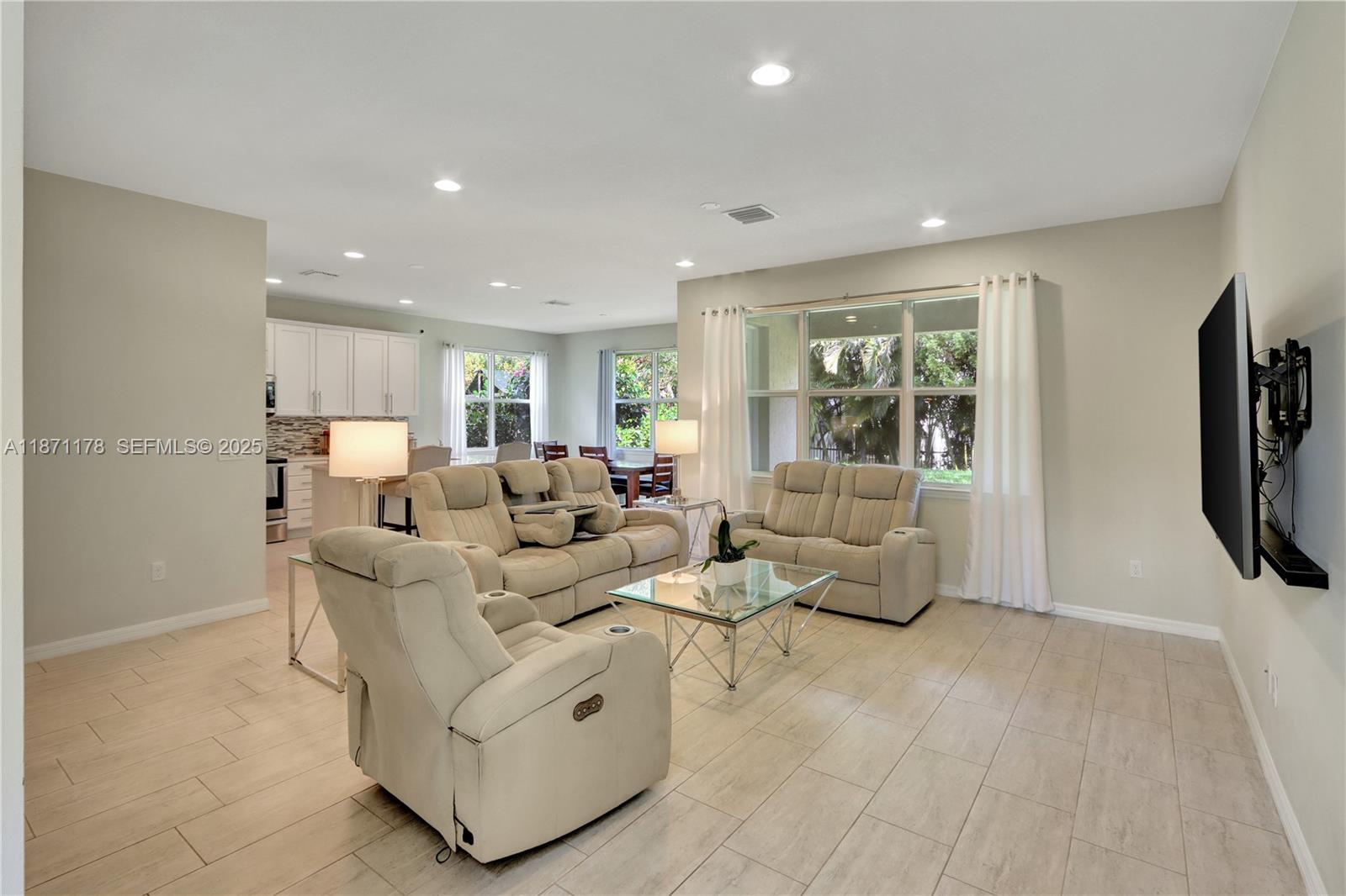 4353 Large Leaf Lane Hollywood, FL 33021 - Photo 7 of 31 a living room with furniture and a flat screen tv