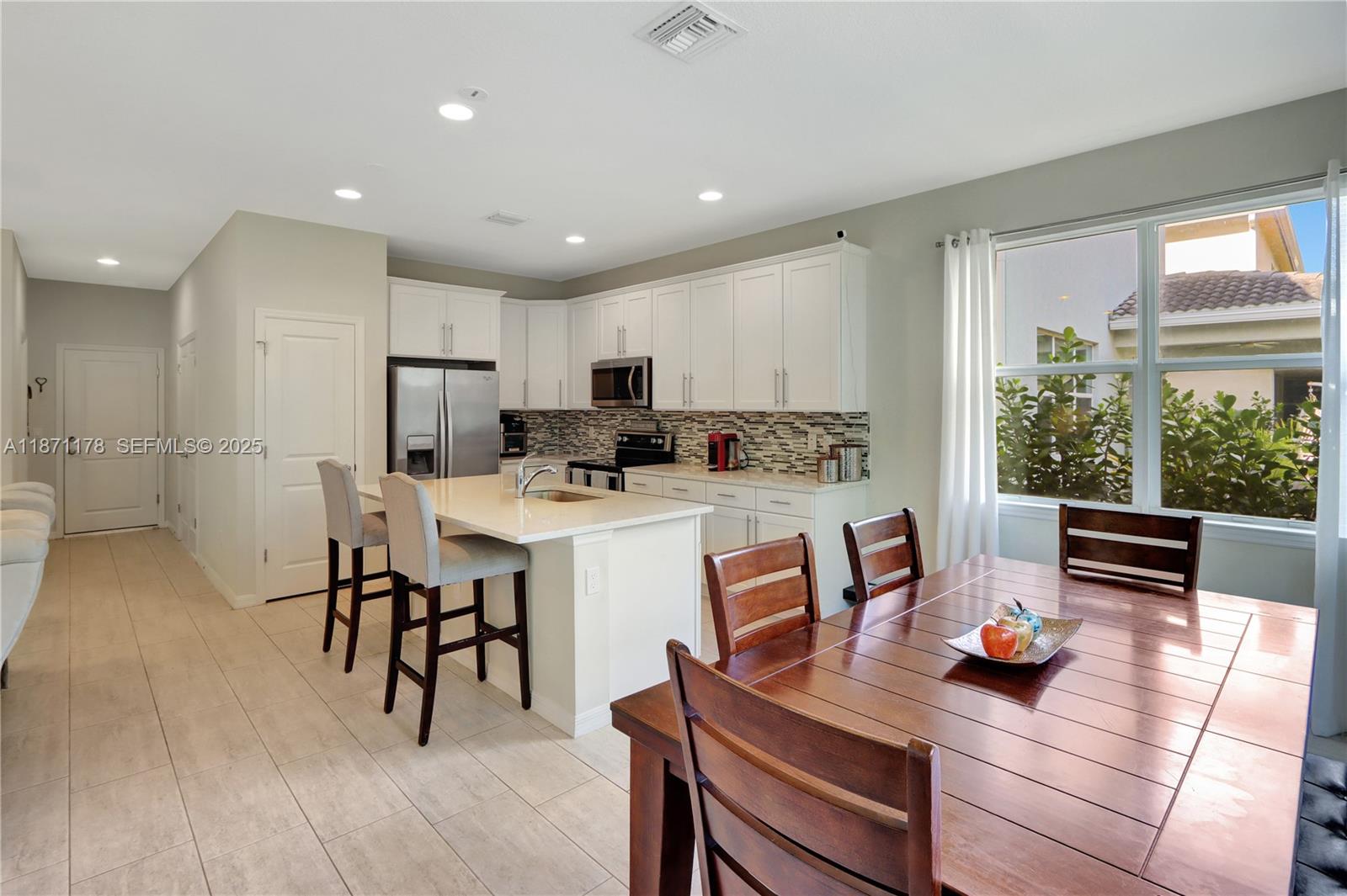 4353 Large Leaf Lane Hollywood, FL 33021 - Photo 9 of 31 a view of a dining room with furniture window and outside view