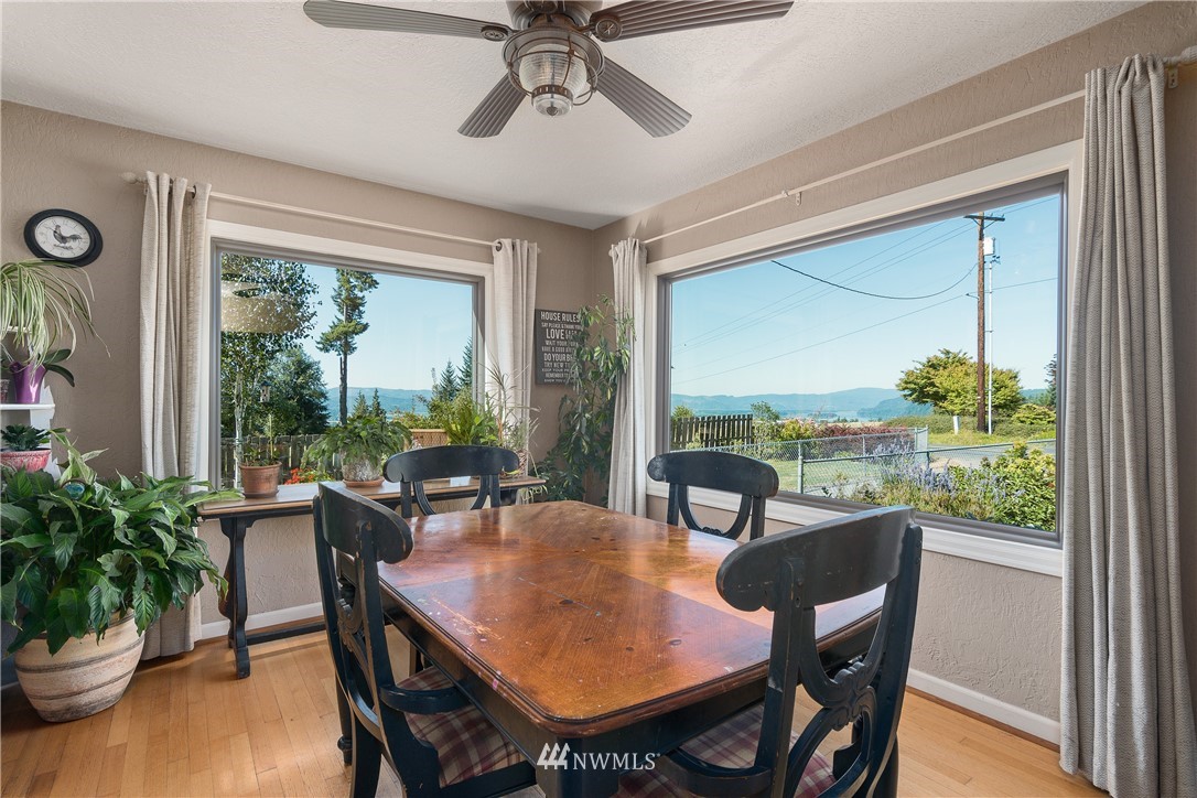 340 Bunker Hill Road Longview, WA 98632 - Photo 4 of 35 a view of a dining room with furniture window and wooden floor
